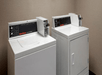Guest laundry area with washers and dryers.