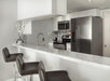 Full kitchen with microwave, refrigerator, dishwasher and stovetop at DoubleTree by Hilton Grand Hotel Biscayne Bay, FL. 