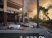 Outdoor seating with fire pit and pond.
