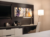 Desk with lamp and chair at DoubleTree by Hilton Hotel Boston - Downtown.