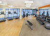 Fitness room with treadmills, and other cardio equipment and weights.
