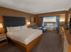 1 King bed, sofa bed, flat-screen TV and work desk inside a guest room at DoubleTree by Hilton Hotel Niagara Falls New York, Niagara Falls, NY. 
