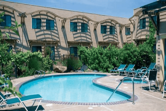 Outdoor pool and sun loungers.