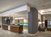Front desk and lobby lounge next to it.