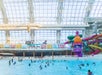 A wave pool with water slides behind it at DreamWorks Water Park at American Dream in Newark, New Jersey.