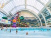 A wave pool full of people on a sunny day at DreamWorks Water Park at American Dream in Newark, New Jersey.