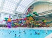 A wave pool with a series of water slides behind it at DreamWorks Water Park at American Dream in Newark, New Jersey.