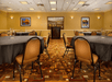 Meeting/conference facility complete with a podium, tables and chairs.