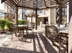 An outdoor patio with tables and chairs.