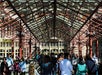 People outside of a building under a steel structure on the Early Access Statue of Liberty Tour with Ellis Island in New York, New York