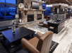 Lobby with seating area, fireplace, TV, and view.