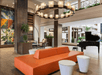 Stylish lobby with seating area and piano.