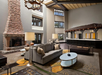 Relaxing lobby with seating area and fire place.