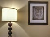 Bedside lamp inside a guest room.