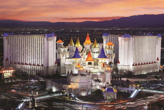 Hotel exterior at dusk.