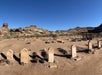 Several old tombstones with mounds of dirt behind them on a sunny day on the Exclusive Access Zion Jeep Tour and Grafton Ghost Town Experience.