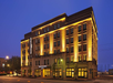 Hotel exterior view at night.