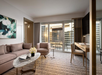 A cozy seating area with a perfect view of the vibrant city skyline
