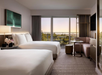 The room features two comfortable double beds for a restful stay.