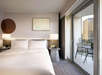 One king bed paired with a private balcony for relaxation.