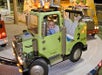 A boy in one of the 4 x 4 big trucks.
