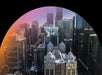 A city skyline features tall glass skyscrapers and historic buildings, with a curved black and orange gradient border framing the upper part of the image.