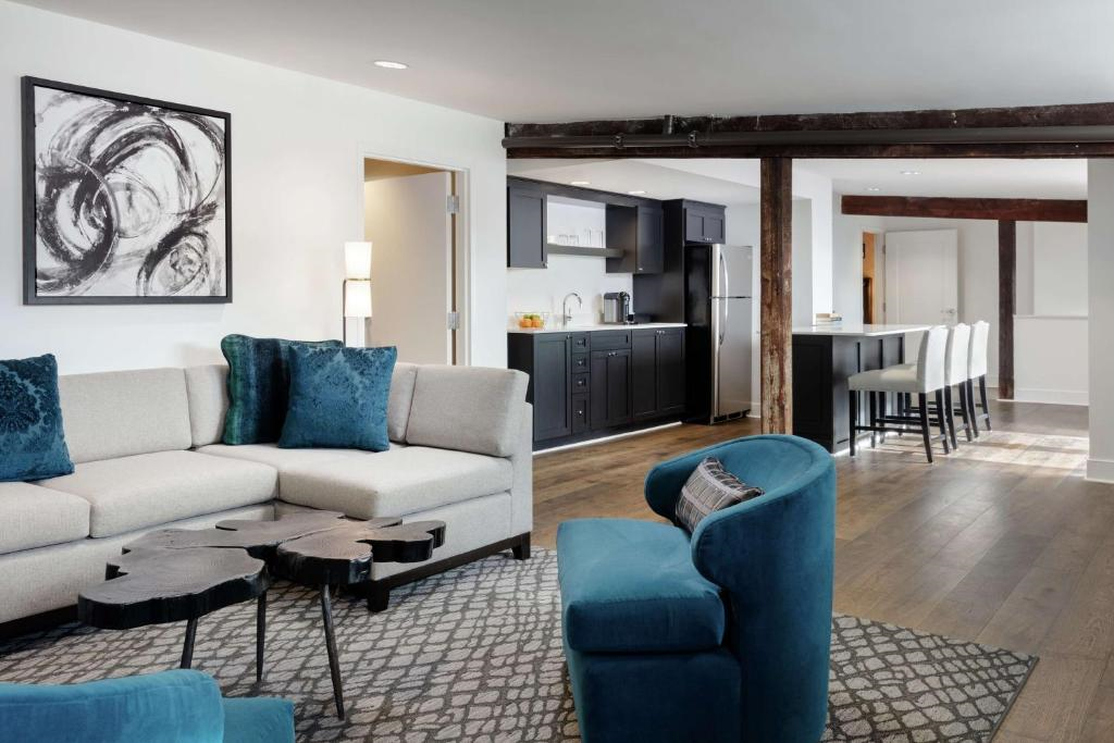 Presidential suite with a large living area, and a kitchen
