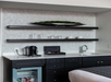 Guest room features a wet bar stacked with drinks