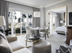 Spacious studio suite featuring a king bed, seating area, and a table for convenience.