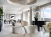 Inviting common area offering plush seating, panoramic views, and a touch of elegance with a piano.