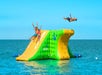 Tour participants using the "tower" water inflatable on the Fury Water Adventure Ultimate Adventure H2.0 in Key West, Florida.