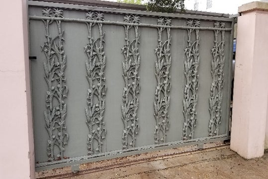 Cast iron in the Garden District that portrays stalks of corn