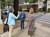 Tour guide talks to a group on the corner of St. Charles Ave.
