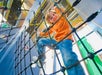 A child climbing on a rope at Boston Children's Museum with Go City - Boston All-Inclusive Pass.