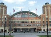 A large building of the Children Museum with flags on top, located at Navy Pier in Chicago.