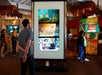 Visitors gaze at various LED displays showcasing Disney's classic animated films at the Walt Disney Museum with Go San Francisco All-Inclusive Pass