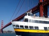 People aboard the boat named "Old Blue" while crossing under the Golden Gate Bridge with Go San Francisco Explorer Pass.