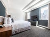 One king bed, flat-screen TV and an expanded window with city views.