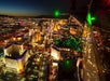 Aerial view of the Las Vegas strip at night with hotel and casino lights illuminating the city on a Maverick helicopter tour.
