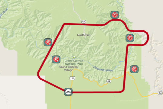 A map showing Grand Canyon National Park with a red outlined route, five hazard warning icons, and one airplane icon at the lower edge.