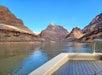 Peaceful boat ride through desert landscapes.