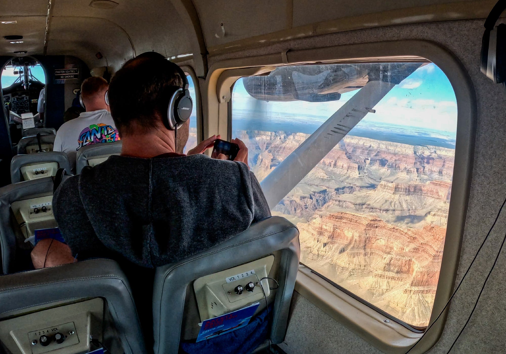 In-flight sightseeing over dramatic canyon landscape.