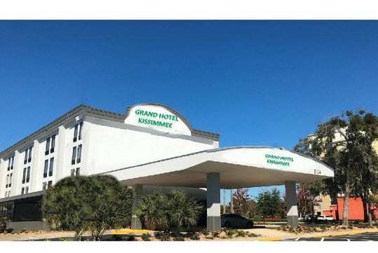 Building exterior and hotel entrance.