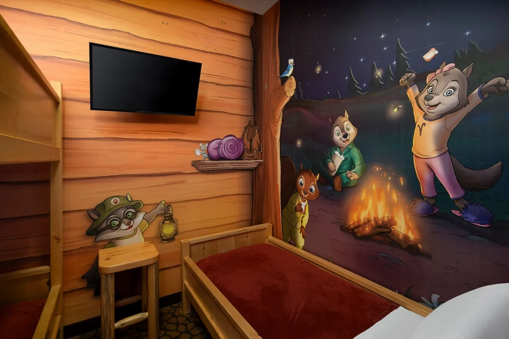 Kid's suite with bunk beds and a flat-screen TV.