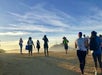 A group of hikers following their tour guide on a rocky area on the Griffith Park Experience: Hollywood Hills Hike.