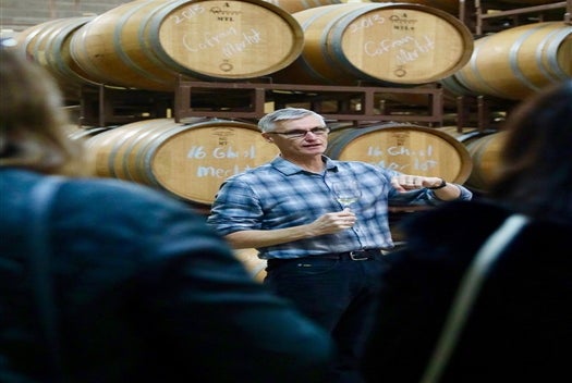 The guide telling the group about the wine on the Half Day Wine Country Experience in San Francisco California USA.