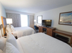2 Queen beds, flat-screen TV, work desk at Hampton Inn Boca Raton, FL.