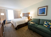 1 King bed, seating area, sofa, work desk at Hampton Inn Boca Raton, FL.