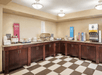 Breakfast area with a variety of breakfast items.
