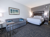 One king bed, carpeted floors, and a sofa sleeper for added space and comfort